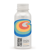 A bottle of Bathing Culture Good Seed Conditioner on a white background with a small 'New' badge in the top right corner. The bottle is white with a colorful retro-style logo featuring blue, green, yellow, and orange concentric shapes.