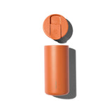 Ceramic Coated Travel Mug in Terracotta with lid off, both casting shadows on a white background.