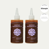 Two bottles of Shiitake Mushroom Oil, each with a pointed nozzle cap, from Algae Cooking Club.