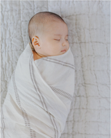 Baby wrapped in fair trade crafted swaddle