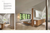 Modern attic bedroom with wood floors from "At Home in the Wine Country: Architecture & Design in CA. Features an open room design with a bathroom setup sharing a wall with a bed
