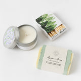 The Renewal Gift Basket features a lavender candle, botanical soap, and tree-design matches for a serene touch.