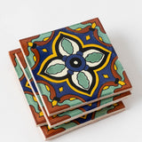 Amina Ceramic Tile Coasters feature a vibrant, symmetrical floral design inspired by Spanish heritage.