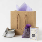 Lavender Fields Gift: brown bag with tissue, organic lavender sachet, travel candle, and French lavender soap.