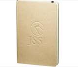 The Custom Logo Recycled Bound Journal (5.5" x 8.5") features a plain brown hardcover with an embossed stylized bird and “JSSI” logo on the front, plus a black ribbon bookmark visible at the top.