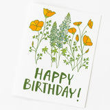 The Happy Birthday California Poppy Note Card is a blank card with hand-drawn yellow and orange poppies, green stems and leaves, and bold green "HAPPY BIRTHDAY!" text on a white background.