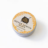 A round tin of Meyer Lemon & Agave Nectar Lip Soother on a white background.