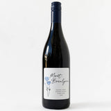A Morét-Brealynn Sonoma Coast Pinot Noir 2024 bottle with a white label and blue flowers.