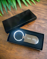 The Official Fiesta Centennial Keychain, engraved with 1924–2024, comes in a black gift box—perfect for celebrating the 100th anniversary. Viva la Fiesta!.