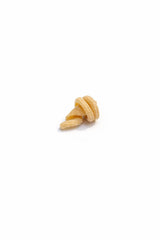 Single piece of Pasta Santina Vorti-Cee bronze die extruded artisanal mafaldine pasta.
