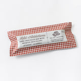 The Pecan & Medjool Date Dark Chocolate Bar is an all-natural, vegan dessert with pecans and Medjool date filling, 70% dark chocolate, no additives, and sweetened with coconut sugar in a red-and-white checkered wrapper.