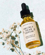 Prickly Pear Serum bottle with dropper on a light background