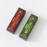 Two lip balm boxes, Vanilla Bean Shimmer and Mistletoe, displayed on a white background.