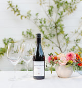 Margerum M5 wine on table setting with Santa Barbara Company flowers