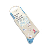 Socks that Protect Oceans folded with a Conscious Step paper label