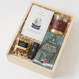 Sweet Tidings Holiday Gift Box with popcorn, chocolate, coffee, peppermint hot chocolate & a festive candle.