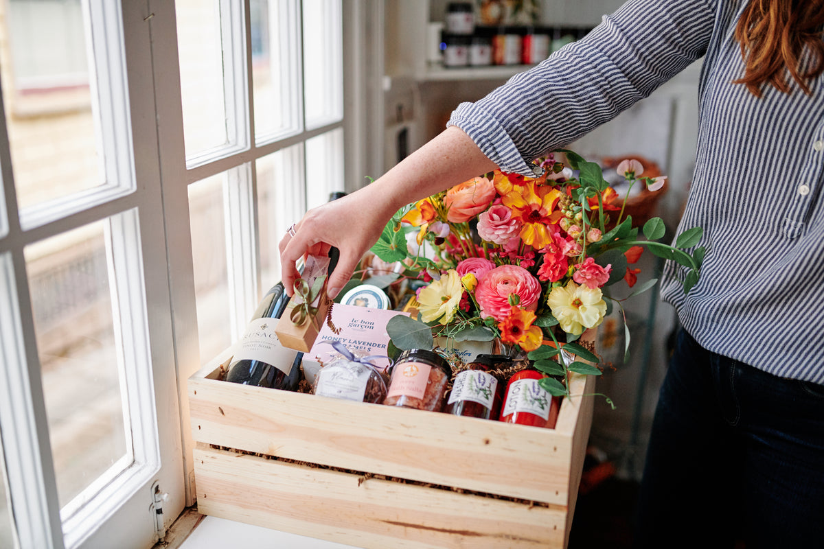 gift basket with wine and flowers
