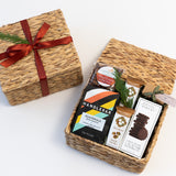Coffee and Treats Gift Box with California snacks, chocolate, coffee, red ribbon, and festive greenery.