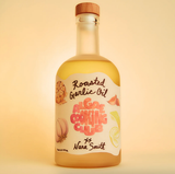 A bottle labeled Roasted Garlic Oil with Yuzu & Miso and Nara Smith's name for Algae Cooking Club.
