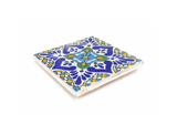Laila Ceramic Tile Coaster Set features an intricate blue, yellow, and green floral pattern on white.