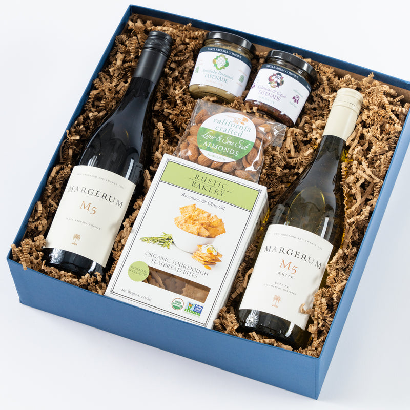 red and white wine in a gift box with crackers, california roasted almonds and tapenade.