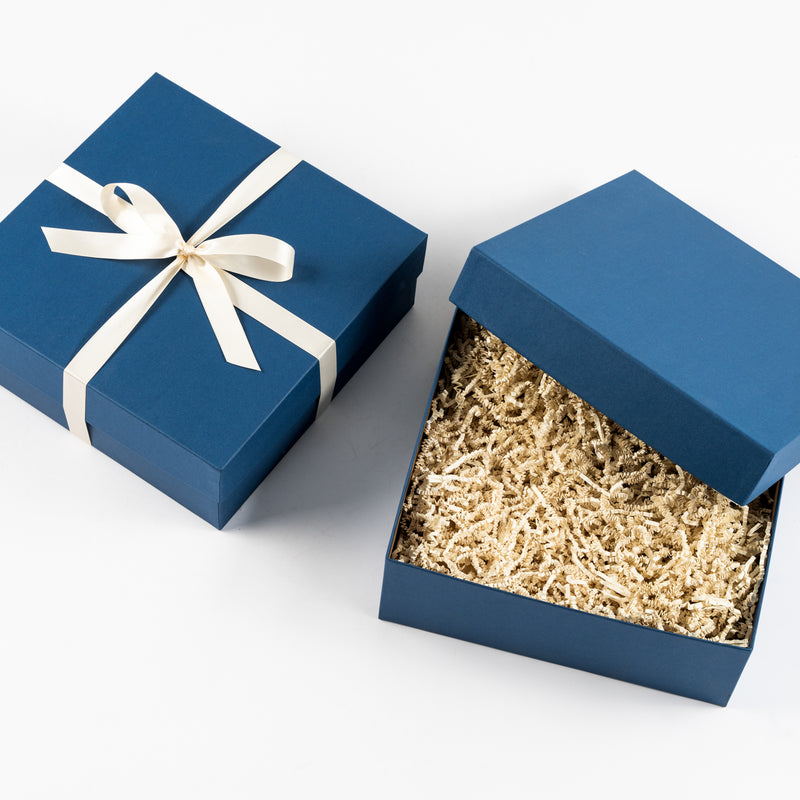 Santa Barbara Company blue gift box with white ribbon