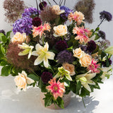 The Regal: A seasonal flower arrangement with lilies, roses, dahlias & hydrangeas in a round vase.