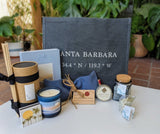 A Miramar Santa Barbara Spa Tote filled with candles, a journal, soap, and other local delights.