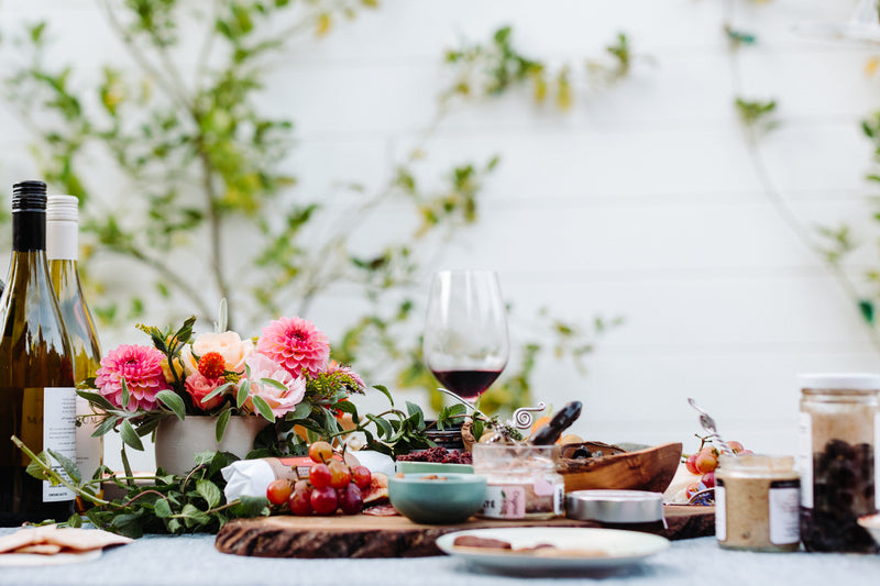 santa barbara company products being enjoyed on a table in an outdoor setting