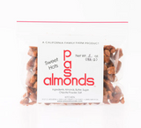 A clear bag of Paso Almonds Sweet Hot Brittle made with California almonds, labeled 0.5 oz and showing ingredients.