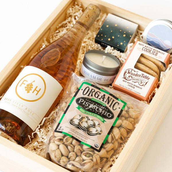 Closeup view of the Lilly Rose California Wine Gift Box with Wine, Candle, Cookies, Pistachios, Matches.