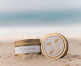 California Candle with California Poppy Lid Design on the beach