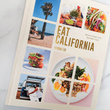 Eat California: Vibrant Recipes from the West Coast is a cookbook by Vivian Lui with colorful food, beach, palm tree, and van photos, offering West Coast recipes inspired by California’s food culture.