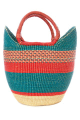 The Fair Trade Woven Basket features two handles wrapped in reddish-brown material and horizontal stripes in teal, red, orange, and natural beige. Handcrafted from elephant grass.