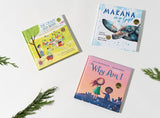 Three children’s books—The Crazy Old Maid, Makana is a Gift: A Little Green Sea Turtle's Quest for Identity and Purpose, and Why Am I—are arranged on a white background with sprigs of greenery, highlighting Makana’s beloved sea turtle tale.