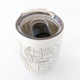 The Map of Napa Insulated Wine Tumbler, featuring an engraved black line map on white stainless steel and a clear plastic lid, rests on a white surface.