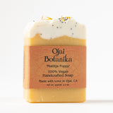 Matilija Poppy Ojai Botanika Soap: 100% vegan, handcrafted in Ojai, CA. Creamy white and yellow layers with Brazilian yellow clay plus dried petals and seeds.