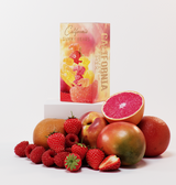 A box of Mixed Fruit California Gummy Bears sits on a white platform with fresh fruit, emphasizing these delicious gummy bears made with premium ingredients, all set against a clean white background.