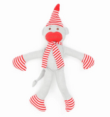 The Monkey in PJs Organic Cotton Stuffed Toy is a gray sock monkey baby made from organic Egyptian cotton, wearing red and white striped hat, scarf, mittens, and socks, with red lips and a playful expression on a white background.