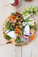 Santa Barbara Herb Green Olives on a cheese plate at a picnic | Slate Catering | Danielle Motif Photography