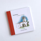 Santa Barbara: A California Coastal Town is a hardcover illustrated book with a cover depicting a white building and clock tower, featuring authors Jane Centofante & Mike West on the front.