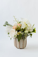 The "Seasonal Flowers - Cup" features a small ceramic vase with white and pale peach blooms and green leaves, arranged for local Santa Barbara delivery only.