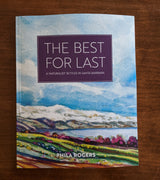 The cover of The Best for Last by Phila Rogers features a watercolor landscape with colorful fields, hills, and a cloudy blue sky.