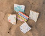 Happy Birthday to the King of the Sea“ greeting card displayed on Santa Barbara’s sunlit beach sand.