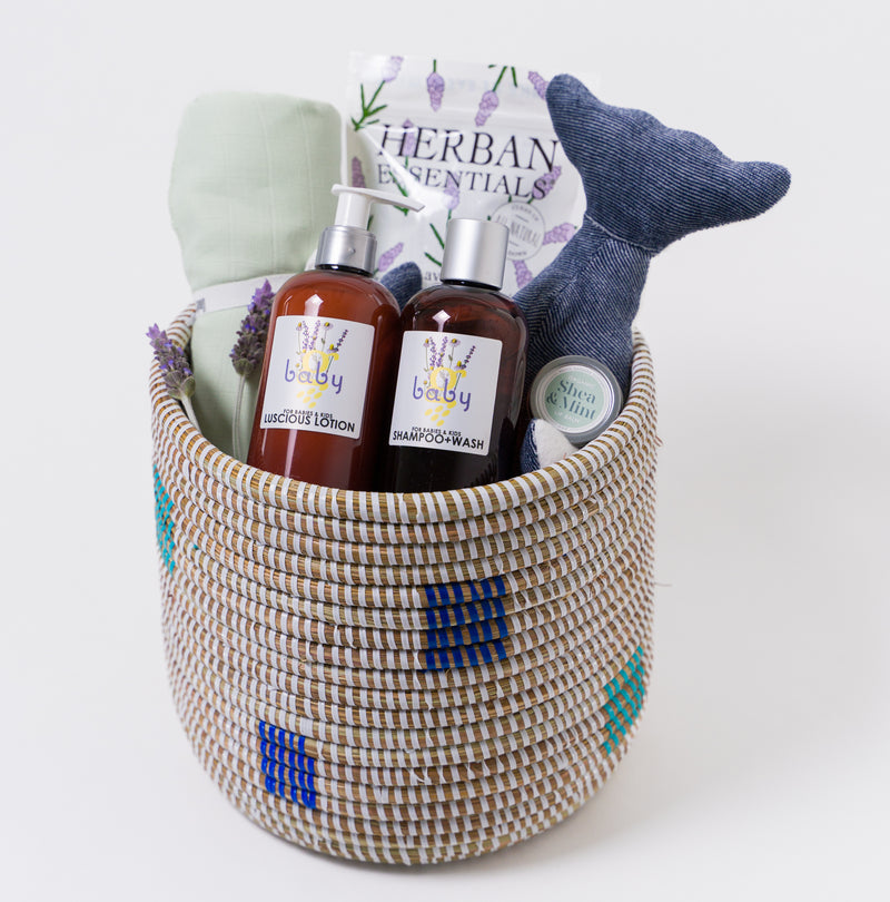 Fair trade woven basket filled with baby bedtime accessories