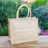 Santa Barbara Coordinates Tote Bag displayed outdoors