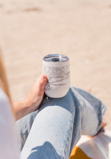 Person holding Santa Barbara Map Wine Tumbler Cup at a beach picnic