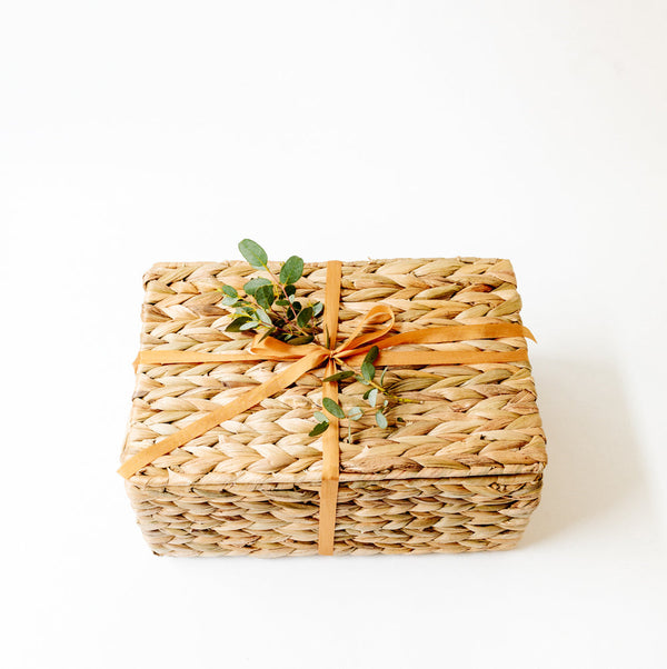 Water hyacinth gift basket with ribbon and eucalyptus leaves