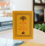 A pocket history of Santa Barbara with books in background